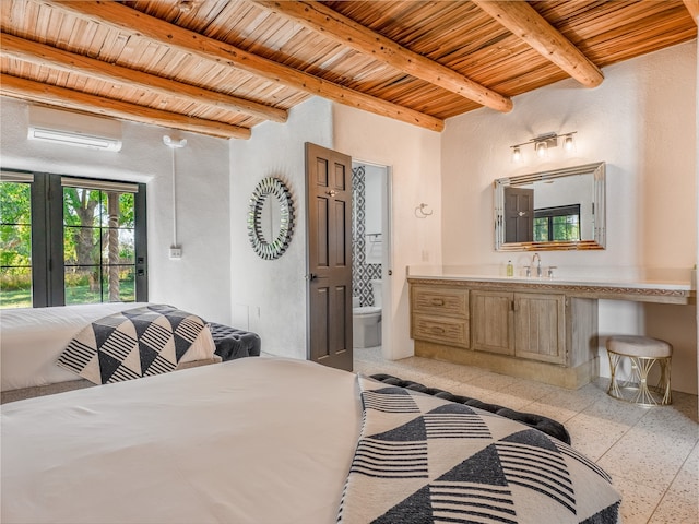 tiled bedroom featuring connected bathroom, wood ceiling, beamed ceiling, a wall mounted AC, and sink