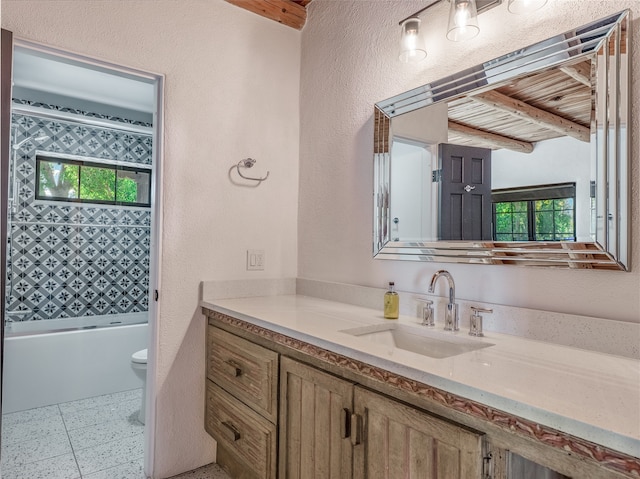 full bathroom featuring tile flooring, beam ceiling, toilet, vanity, and shower / bathing tub combination