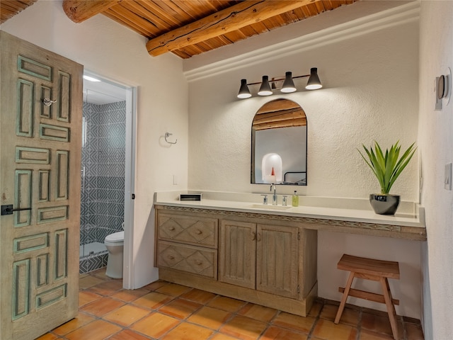 bathroom featuring toilet, wood ceiling, beamed ceiling, tile floors, and vanity