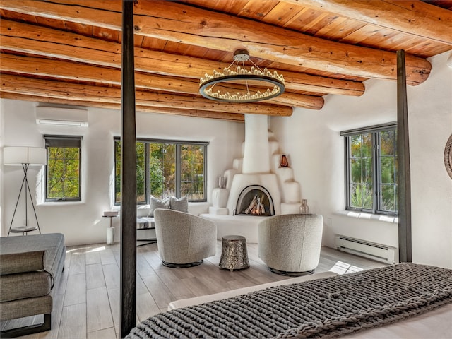 bedroom with wood ceiling, beam ceiling, a baseboard heating unit, and light hardwood / wood-style flooring