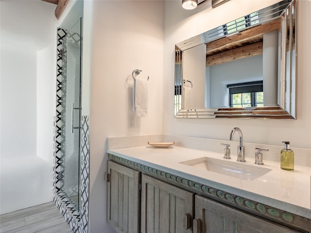 bathroom with wood-type flooring and vanity