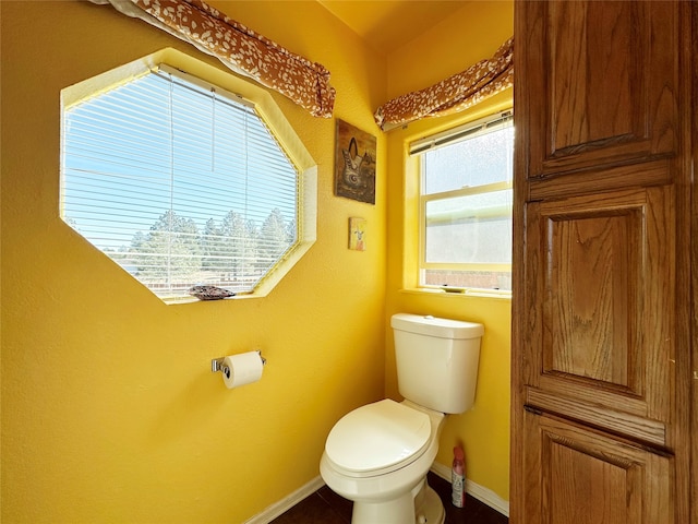 bathroom featuring toilet and tile patterned floors