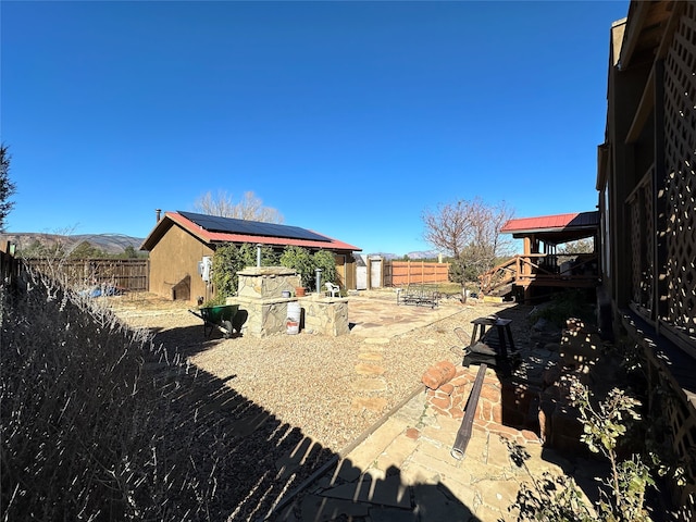 view of yard with a patio and an outdoor structure