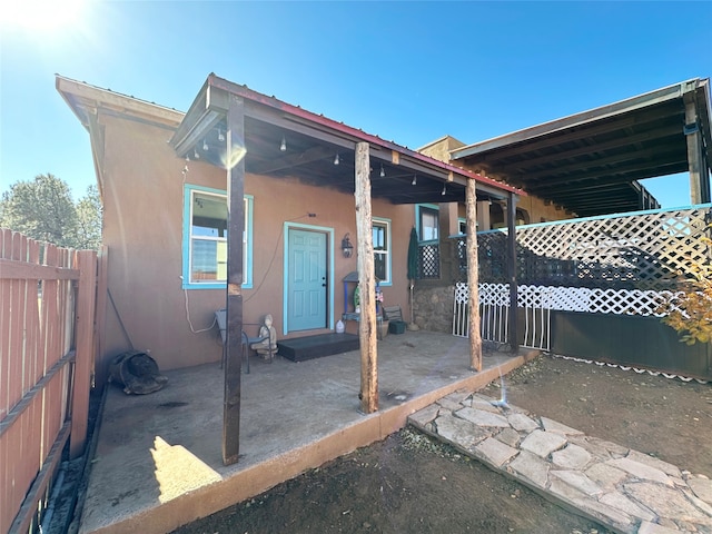 rear view of house featuring a patio