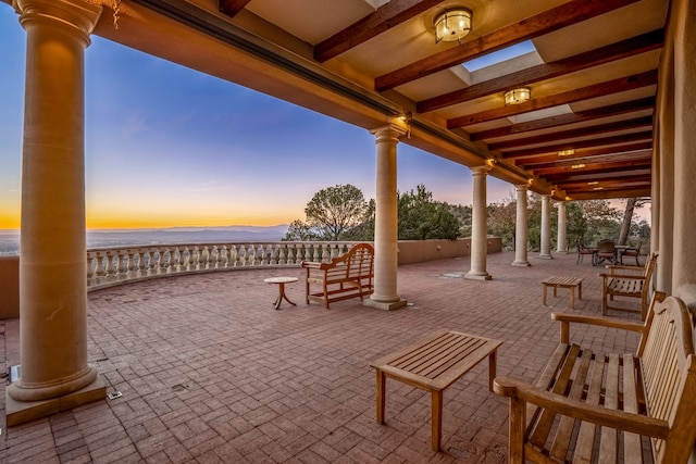 view of patio terrace at dusk