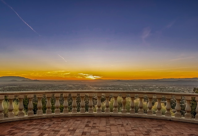 exterior space with a balcony and a mountain view