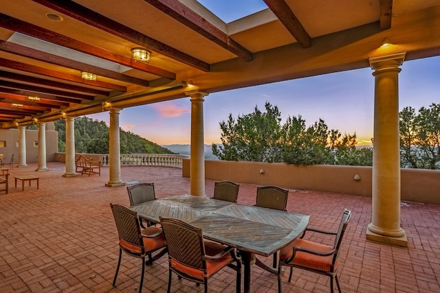 view of patio terrace at dusk