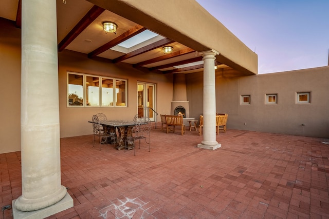 view of patio terrace at dusk