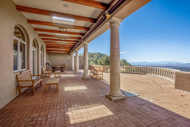 view of terrace with a mountain view