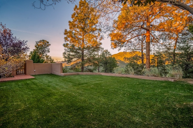 yard at dusk with a mountain view