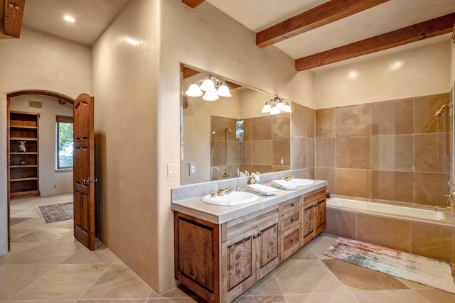 bathroom featuring built in features, an inviting chandelier, tile floors, beam ceiling, and dual vanity