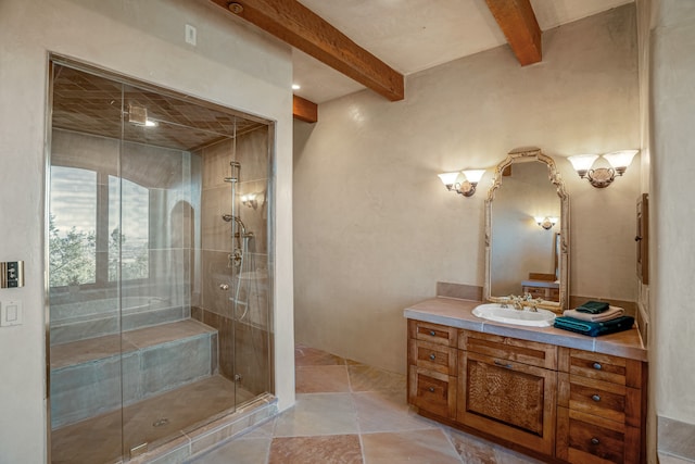 bathroom featuring tile floors, beam ceiling, vanity, and a shower with shower door