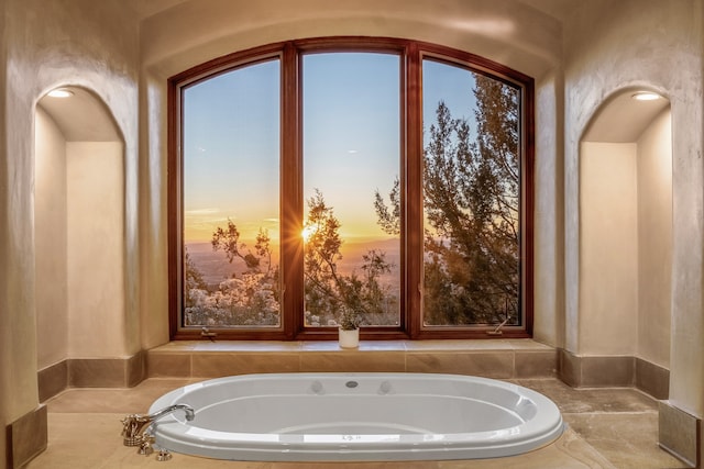 bathroom featuring a bath to relax in