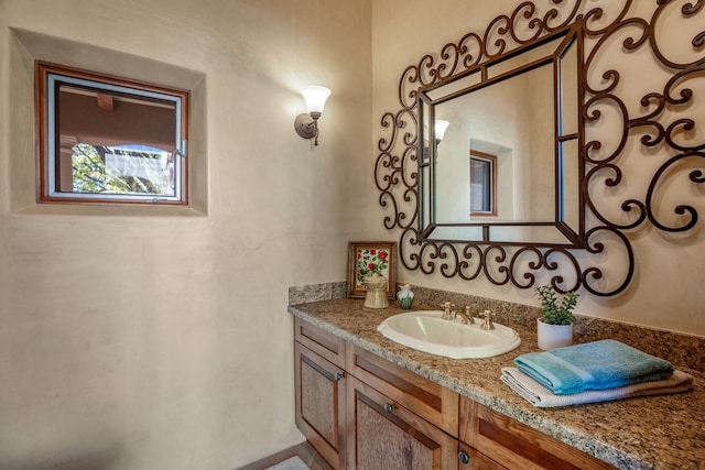 bathroom featuring vanity with extensive cabinet space