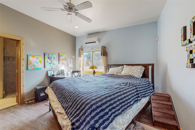 bedroom featuring ceiling fan, a wall mounted AC, and hardwood / wood-style floors