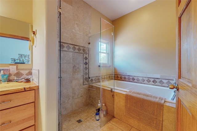 bathroom with plus walk in shower, vanity, and tile flooring