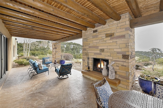 view of patio featuring an outdoor living space with a fireplace