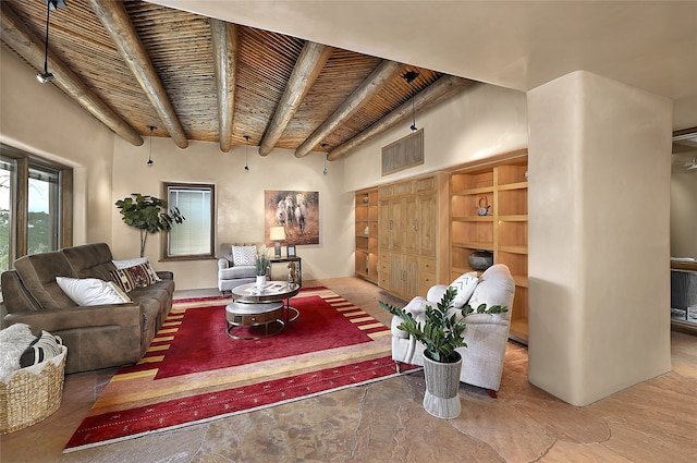 living room with beamed ceiling, wood ceiling, and a towering ceiling