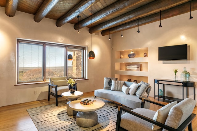 living room featuring wood ceiling, wood-type flooring, a wealth of natural light, and beam ceiling