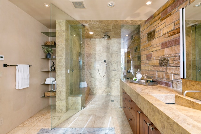 bathroom with tile patterned floors, a shower with shower door, and vanity