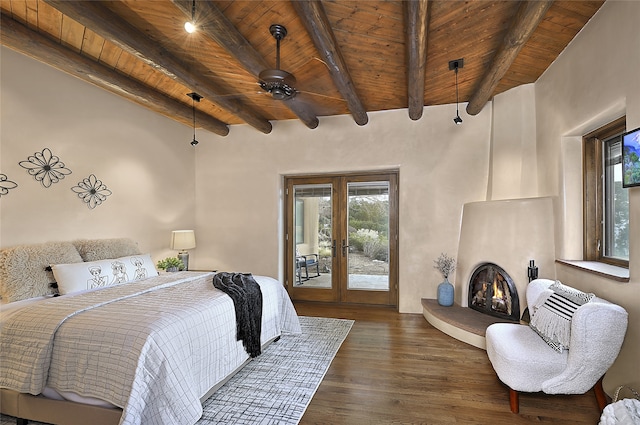 bedroom with dark wood-type flooring, beamed ceiling, access to exterior, and wood ceiling