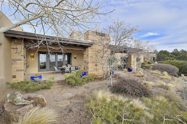 rear view of house with a patio