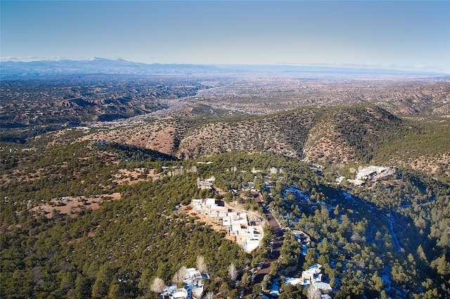 birds eye view of property with a mountain view