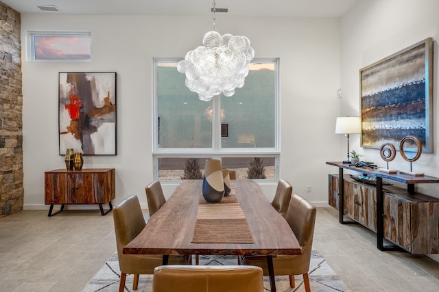 dining room featuring a notable chandelier and a healthy amount of sunlight