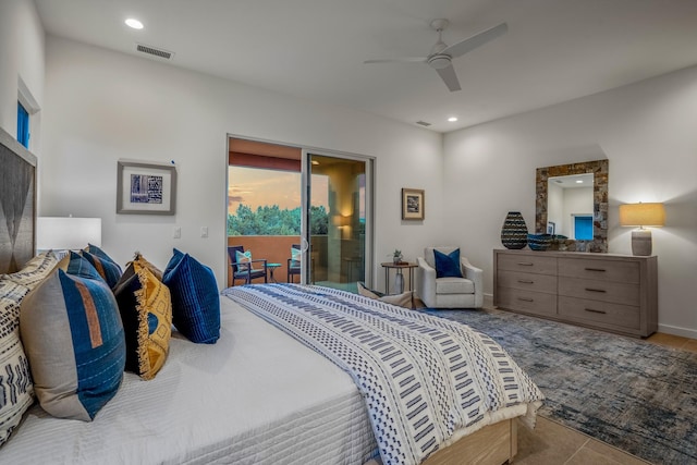 bedroom with ceiling fan, light tile patterned floors, and access to exterior