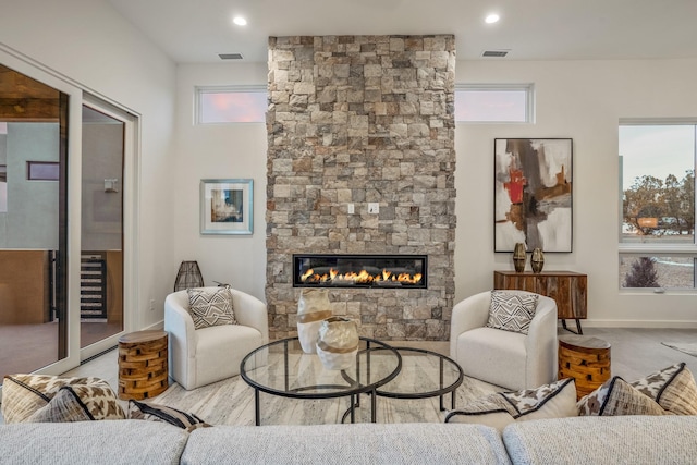 living room with a wealth of natural light and a fireplace