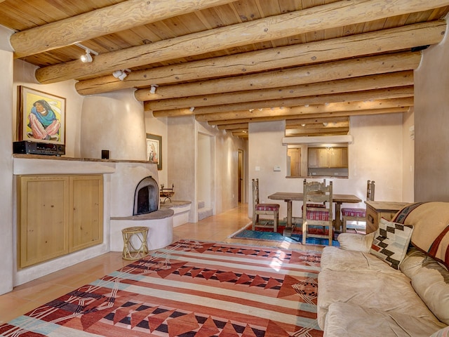 living room with wood ceiling, rustic walls, beam ceiling, and light tile floors