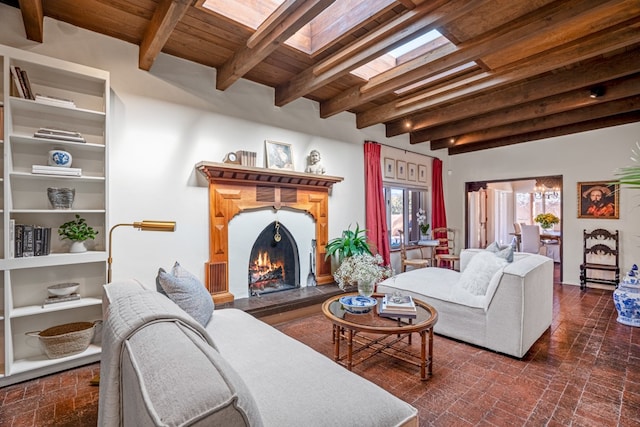 living room with built in shelves, wooden ceiling, beamed ceiling, and a skylight