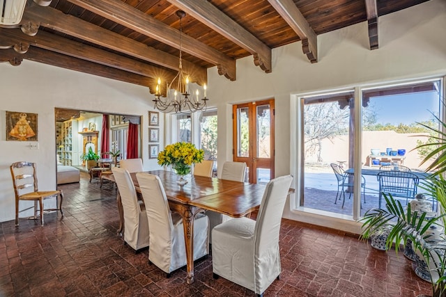 dining area with wooden ceiling, a notable chandelier, french doors, and beamed ceiling