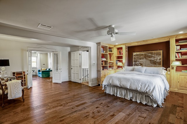 bedroom featuring ceiling fan and dark hardwood / wood-style flooring