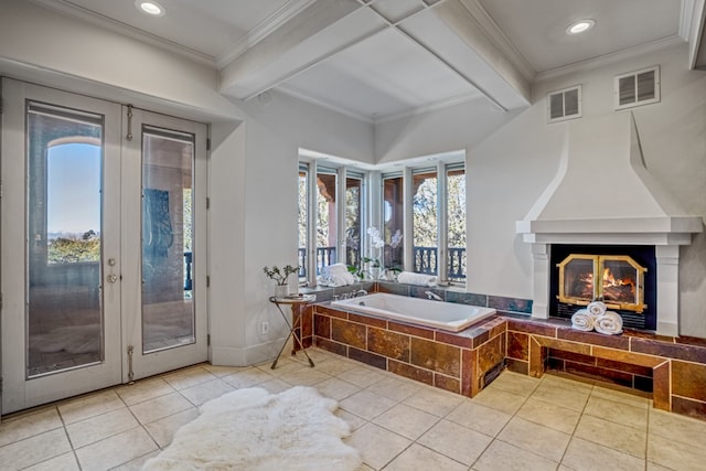 bathroom with french doors, ornamental molding, tiled tub, tile flooring, and beam ceiling