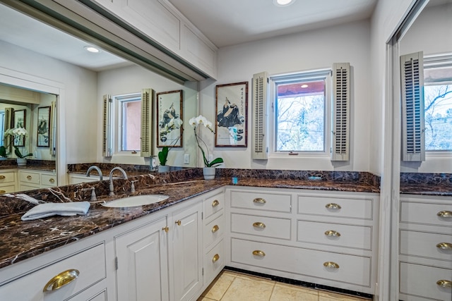 bathroom featuring tile floors and vanity