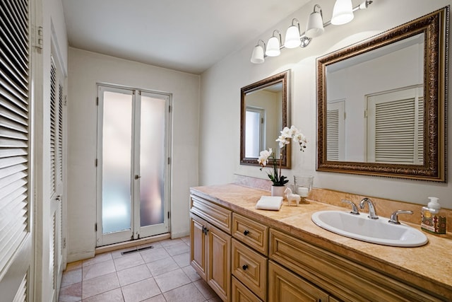 bathroom featuring large vanity and tile flooring