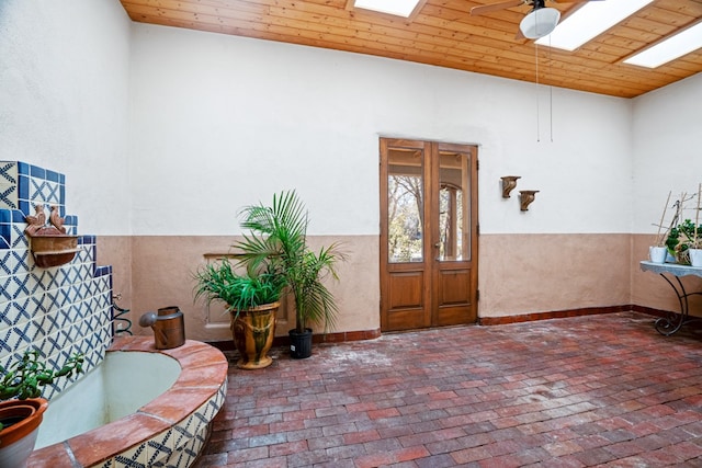 property entrance with ceiling fan and a patio area