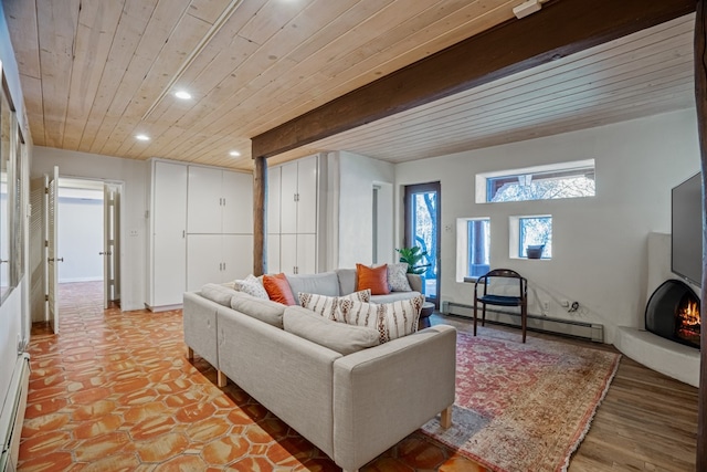 living room with light wood-type flooring and a baseboard heating unit