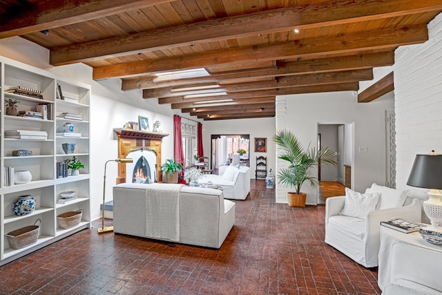 living room featuring brick wall and beam ceiling