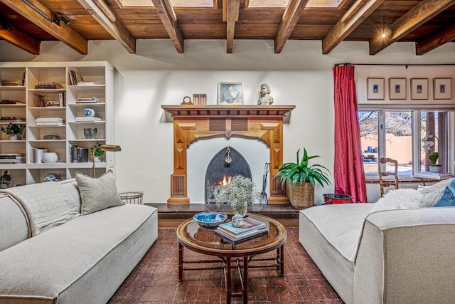 living room featuring wood ceiling and beamed ceiling