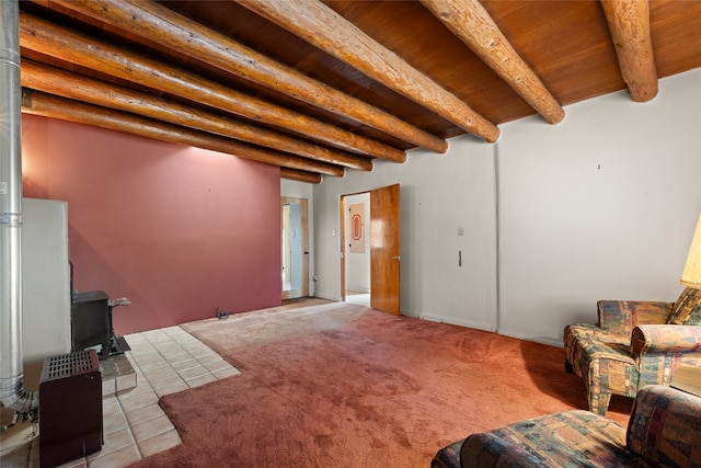 living room with a wood stove, wooden ceiling, light tile floors, and beamed ceiling