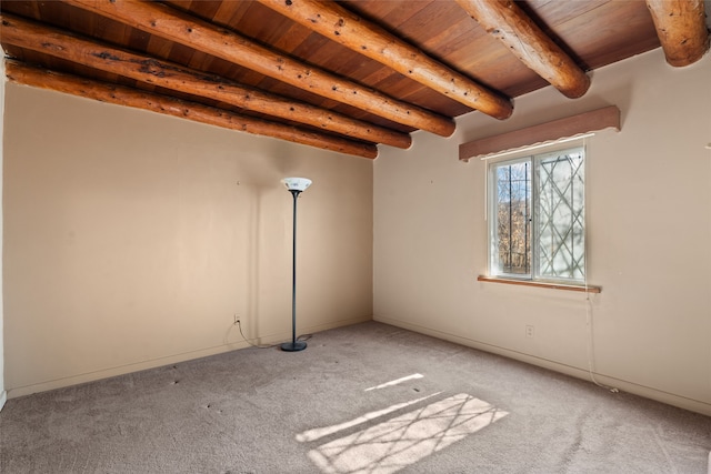 unfurnished room featuring light colored carpet, wood ceiling, and beamed ceiling