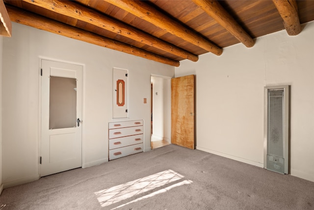 unfurnished bedroom featuring beam ceiling, light carpet, and wood ceiling