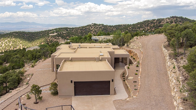 drone / aerial view featuring a mountain view