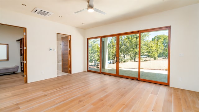 spare room featuring light hardwood / wood-style floors and ceiling fan