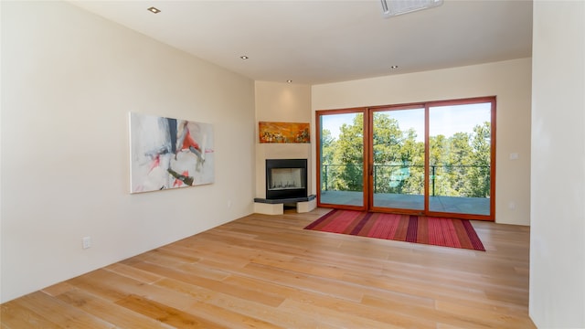 unfurnished living room with light wood-type flooring