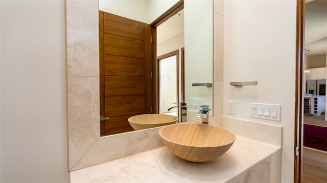 bathroom featuring vanity and wood-type flooring