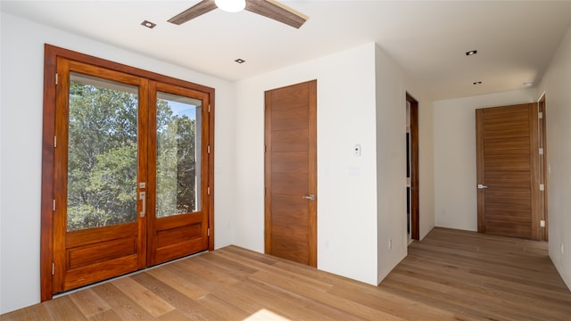 entrance foyer featuring ceiling fan, light hardwood / wood-style flooring, and french doors