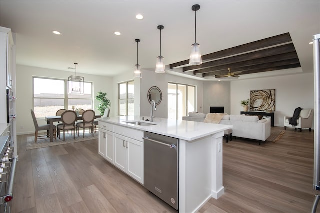 kitchen with white cabinetry, light hardwood / wood-style flooring, and pendant lighting